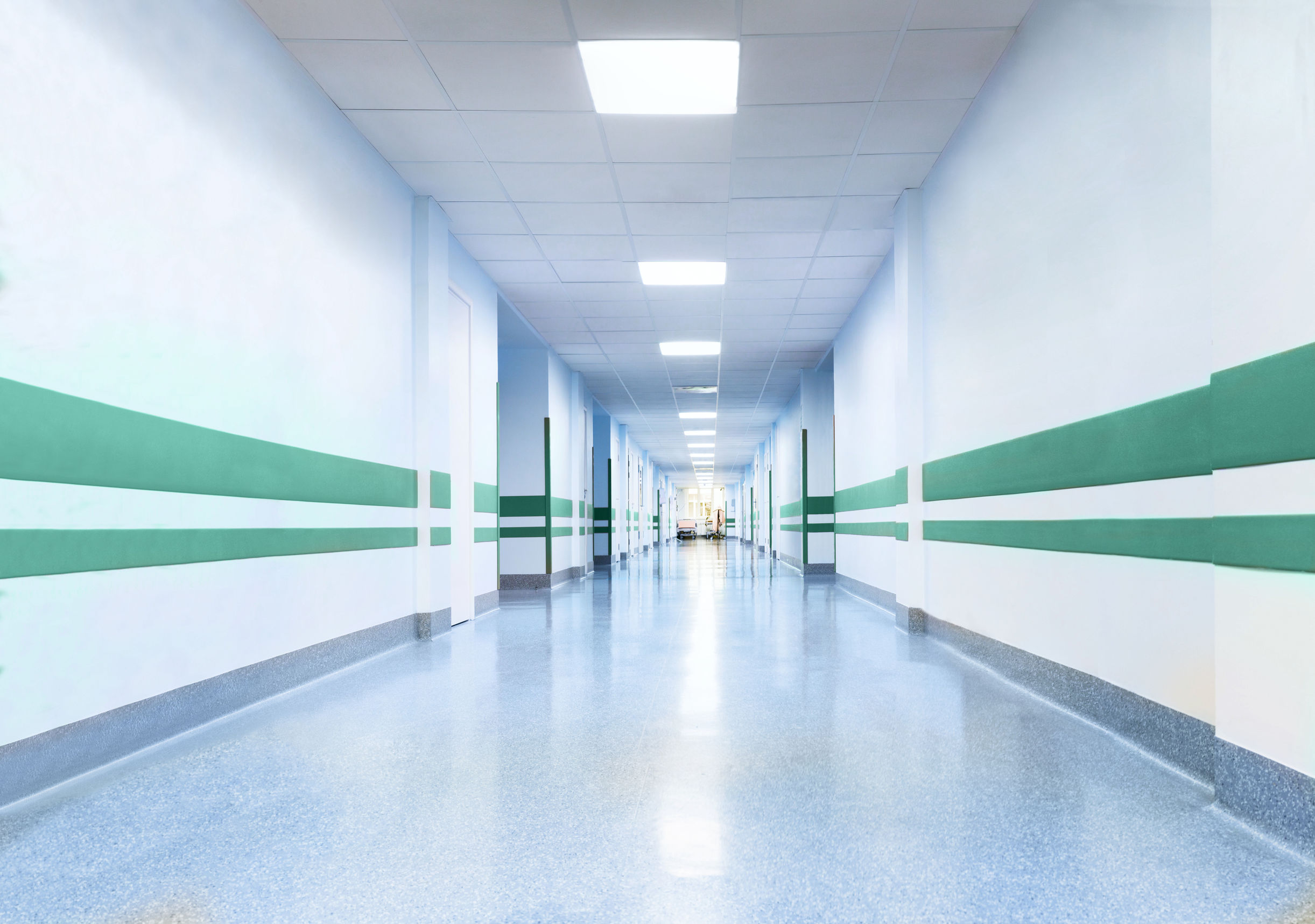 38981286 - long corridor in hospital with doors and reflections
